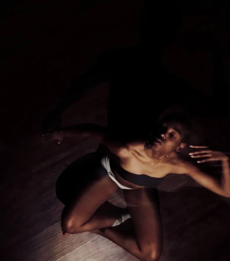 JustBee on the floor in a single pool of light