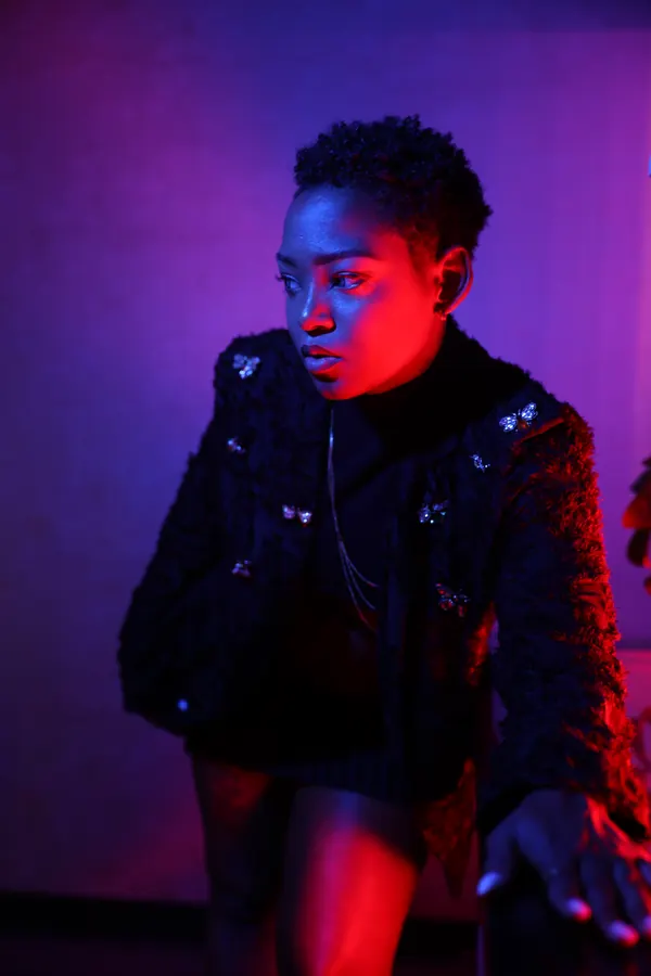 JustBee in red and blue neon light