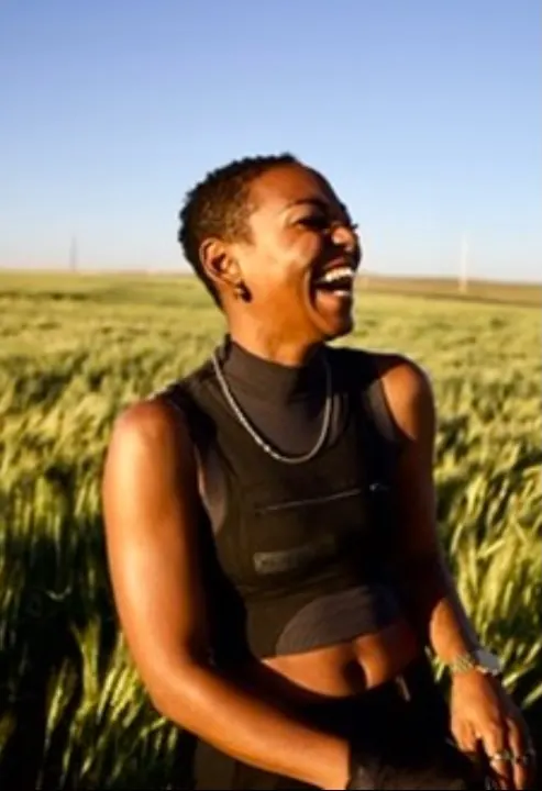 JustBee laughing in a wheat field